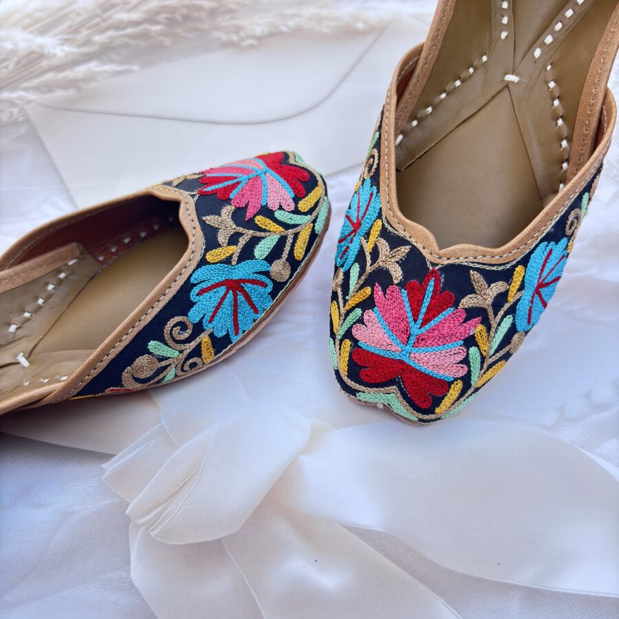 Black base hand embroidered multi coloured kashmiri embroidery Punjabi jutti for women, floral design, pure leather, double cushioned jutti by sandoori, free shipping, free exchange, latest design, branded jutti, main colours black, red, pink, maroon, green, brown, blue