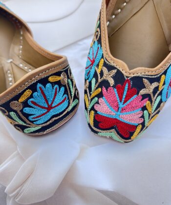 Black base hand embroidered multi coloured kashmiri embroidery Punjabi jutti for women, floral design, pure leather, double cushioned jutti by sandoori, free shipping, free exchange, latest design, branded jutti, main colours black, red, pink, maroon, green, brown, blue
