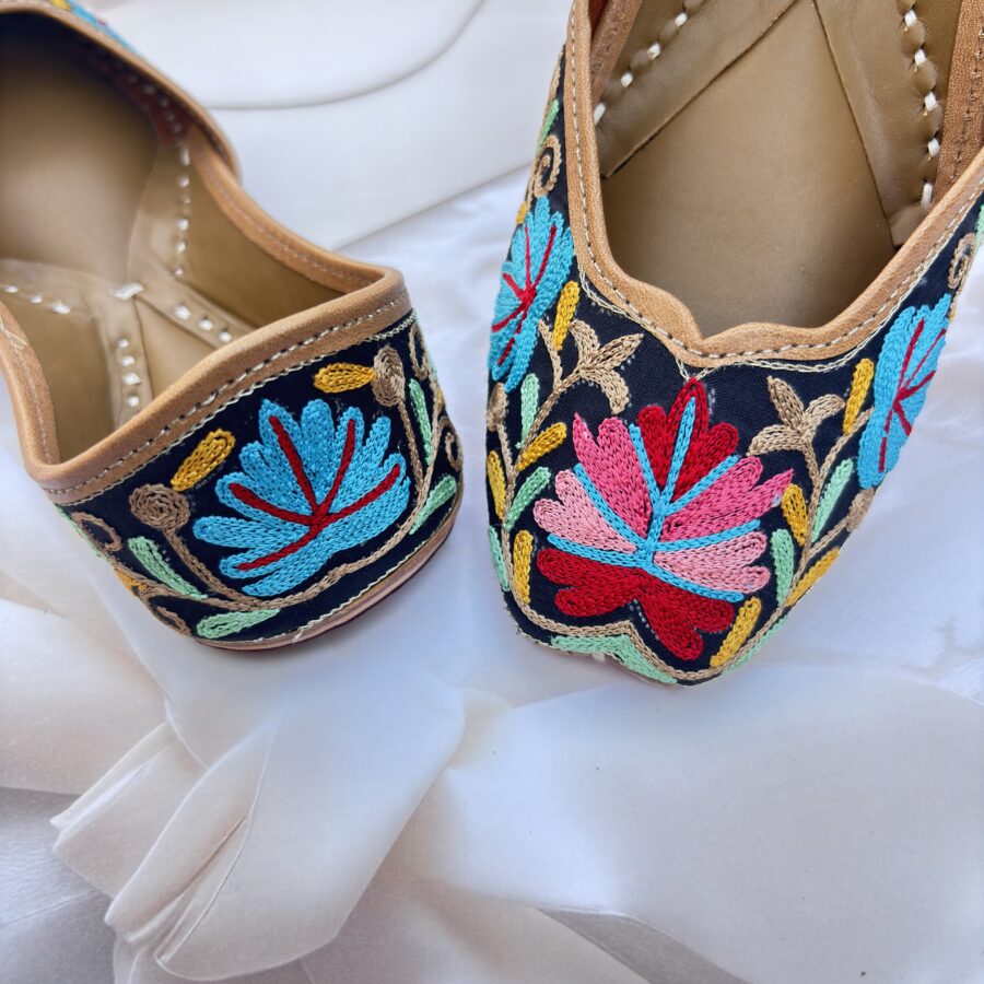 Black base hand embroidered multi coloured kashmiri embroidery Punjabi jutti for women, floral design, pure leather, double cushioned jutti by sandoori, free shipping, free exchange, latest design, branded jutti, main colours black, red, pink, maroon, green, brown, blue