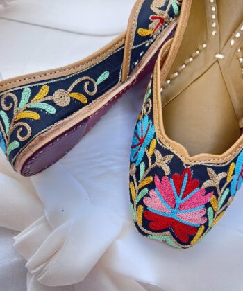 Black base hand embroidered multi coloured kashmiri embroidery Punjabi jutti for women, floral design, pure leather, double cushioned jutti by sandoori, free shipping, free exchange, latest design, branded jutti, main colours black, red, pink, maroon, green, brown, blue