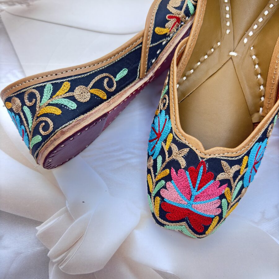 Black base hand embroidered multi coloured kashmiri embroidery Punjabi jutti for women, floral design, pure leather, double cushioned jutti by sandoori, free shipping, free exchange, latest design, branded jutti, main colours black, red, pink, maroon, green, brown, blue