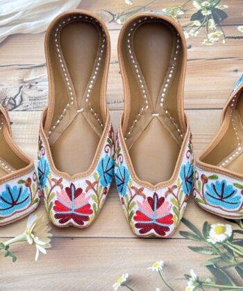 White base hand embroidered multi coloured kashmiri embroidery Punjabi jutti for women, floral design, pure leather, double cushioned jutti by sandoori jutti, free shipping, free exchange, latest design, branded jutti, main colours white, red, pink, maroon, green, brown, blue kashmiri jutti hand embroidered