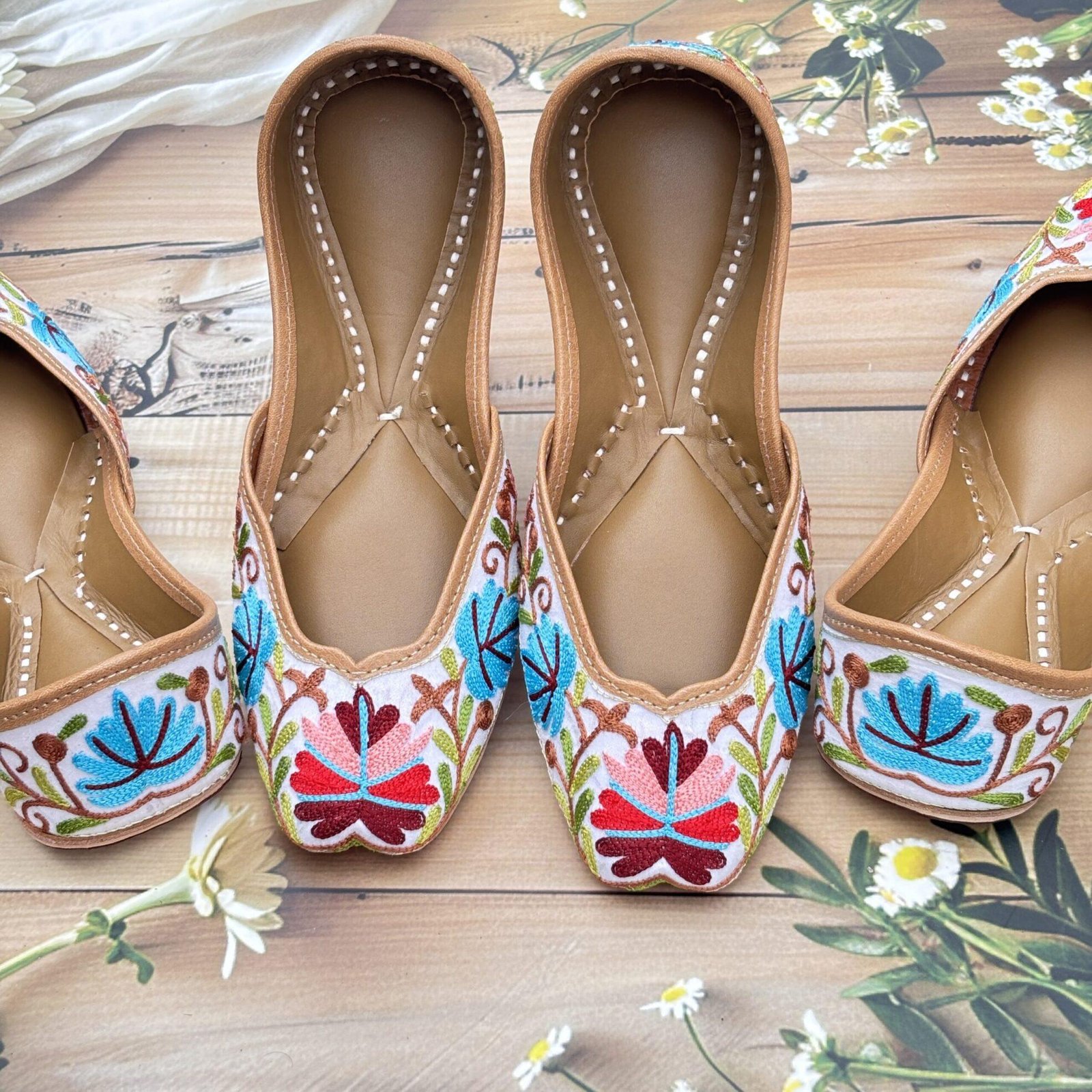 kashmiri-jutti-hand-embroidered3 White base hand embroidered multi coloured kashmiri embroidery Punjabi jutti for women, floral design, pure leather, double cushioned jutti by sandoori jutti, free shipping, free exchange, latest design, branded jutti, main colours white, red, pink, maroon, green, brown, blue kashmiri jutti hand embroidered