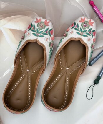 White base multi coloured hand embroidered Punjabi jutti for women, pure leather, double cushioned jutti by sandoori jutti, free shipping, free exchange, latest design, branded jutti, main colours green, pink, peach, white
