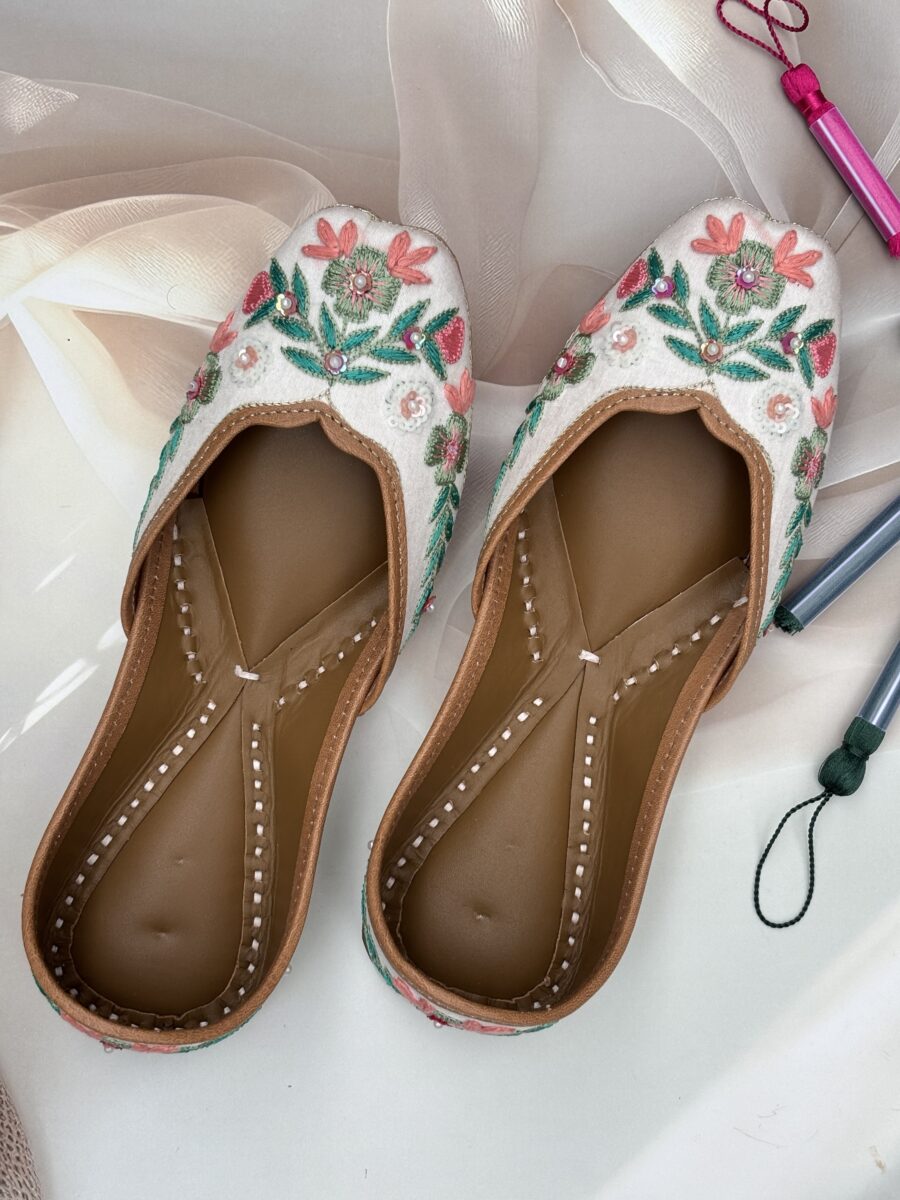 White base multi coloured hand embroidered Punjabi jutti for women, pure leather, double cushioned jutti by sandoori jutti, free shipping, free exchange, latest design, branded jutti, main colours green, pink, peach, white
