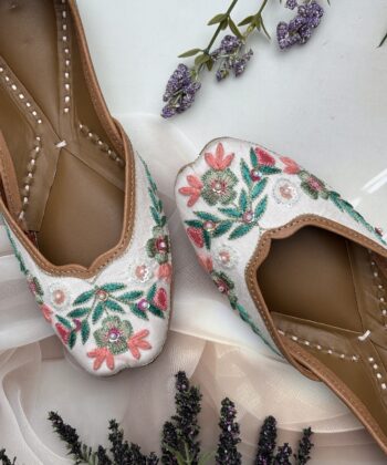 White base multi coloured hand embroidered Punjabi jutti for women, pure leather, double cushioned jutti by sandoori jutti, free shipping, free exchange, latest design, branded jutti, main colours green, pink, peach, white