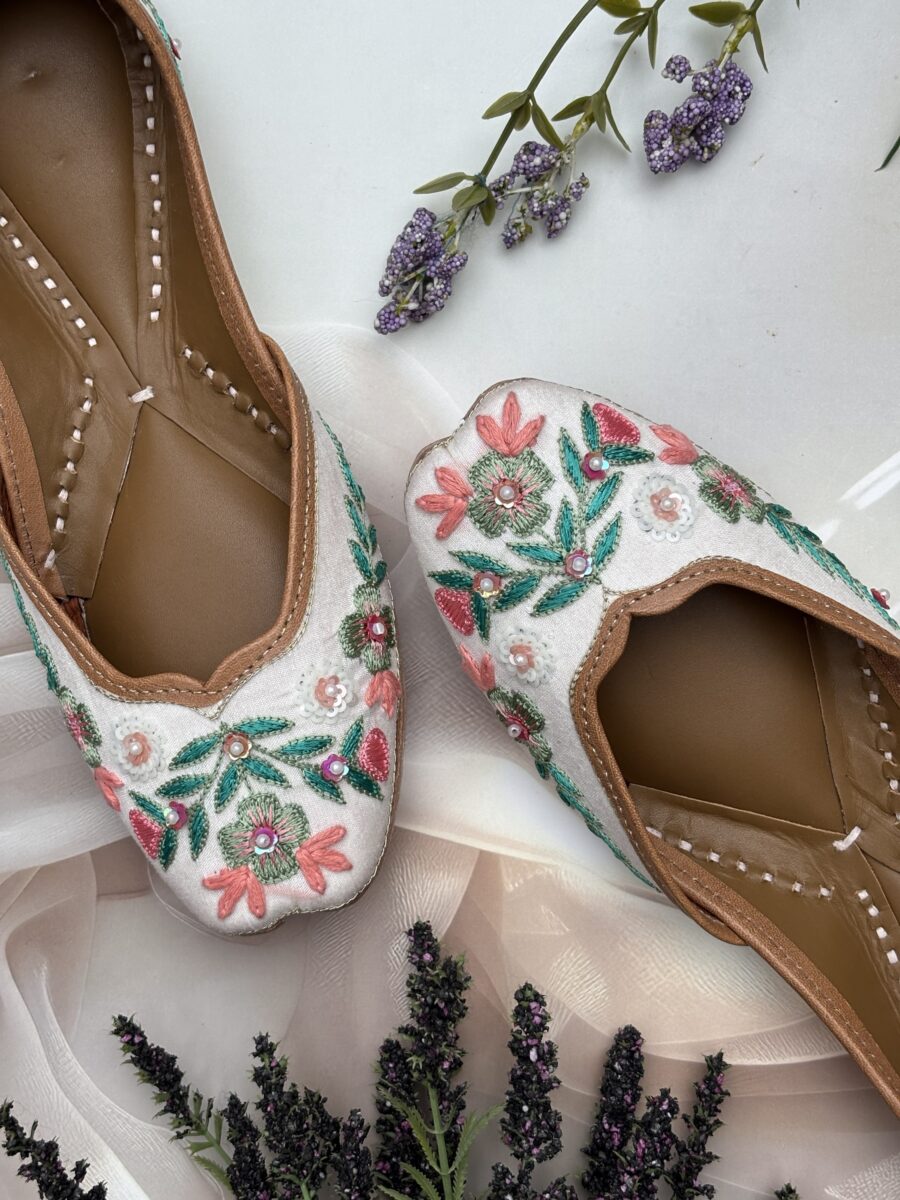 White base multi coloured hand embroidered Punjabi jutti for women, pure leather, double cushioned jutti by sandoori jutti, free shipping, free exchange, latest design, branded jutti, main colours green, pink, peach, white