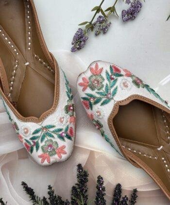 White base multi coloured hand embroidered Punjabi jutti for women, pure leather, double cushioned jutti by sandoori jutti, free shipping, free exchange, latest design, branded jutti, main colours green, pink, peach, white