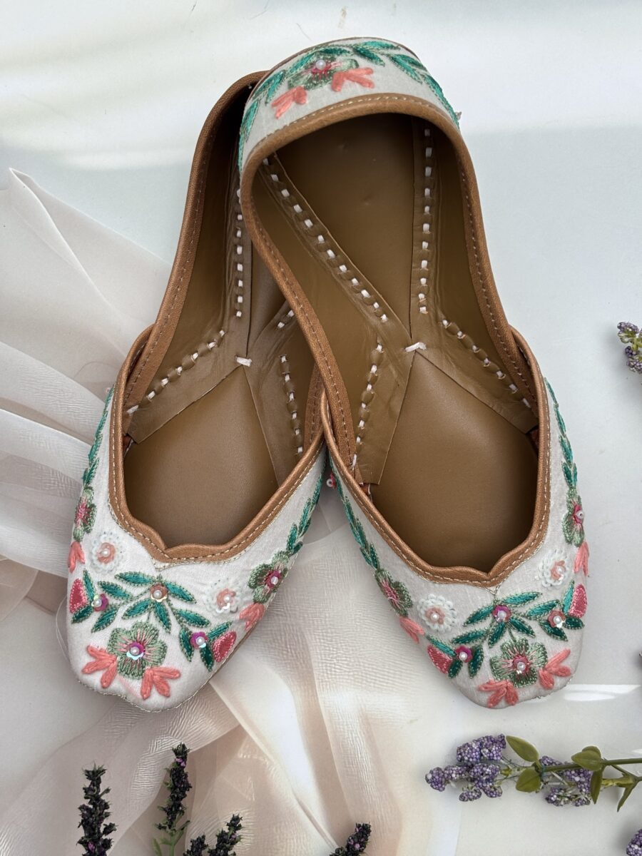 White base multi coloured hand embroidered Punjabi jutti for women, pure leather, double cushioned jutti by sandoori jutti, free shipping, free exchange, latest design, branded jutti, main colours green, pink, peach, white