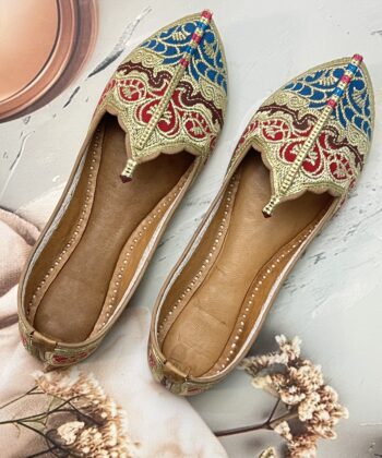 Biba Jutti with Phirozy and Magenta velvet inserts and hand embroidered with Golden tilla (Zari). A stunning blend of tradition and comfort. Lovingly handcrafted by skilled artisans, this Punjabi jutti, also known as mojari or Delhi fashion jutti