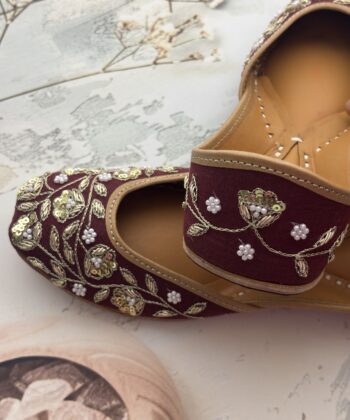 Maroon hand embroidered jutti with golden sequins and pearls