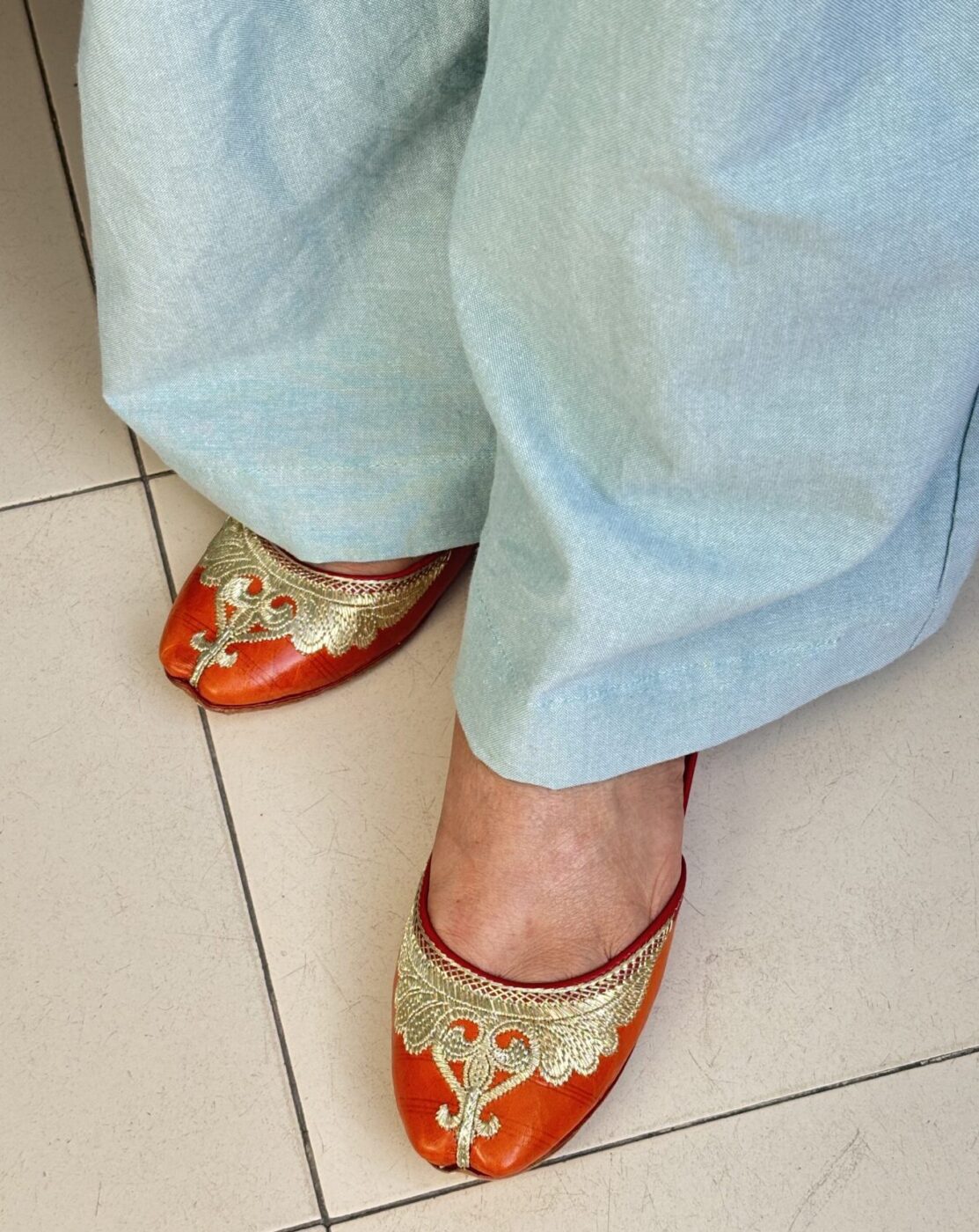 IMG_9847 pure leather light weight daily wear orange jooti, golden zari hand work